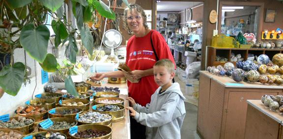 Kyle and Diana inspecting specimens of rock at Richardson's Rock Shop
